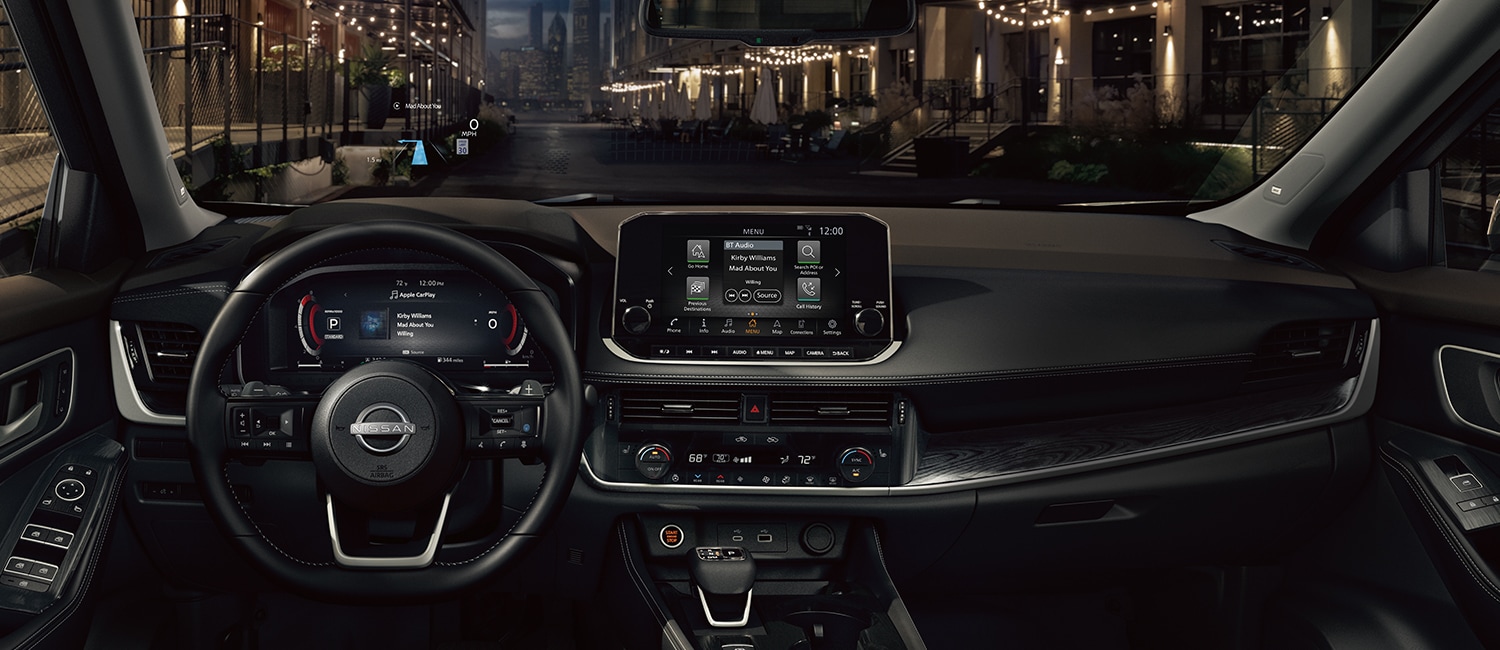 2022 Nissan Rogue driver's perspective at night showing high-tech displays.