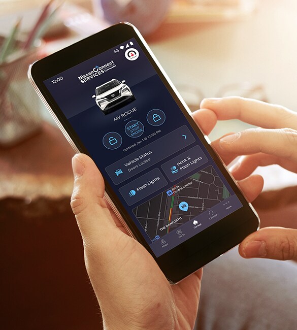 2022 Nissan Rogue showing Nissanconnect app on smartphone.