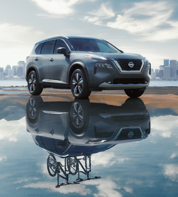 2022 Nissan Rogue with city skyline in the background