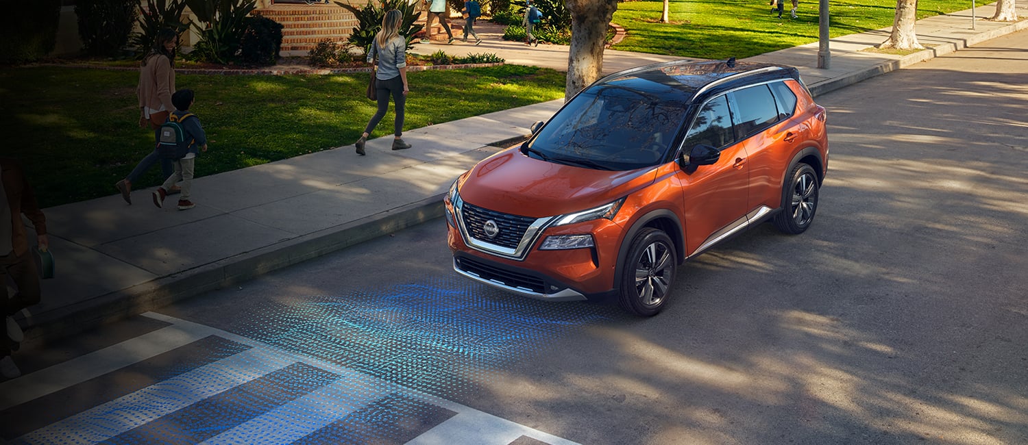 2023 Nissan Rogue stopped at a crosswalk illustrating safety shield 360 sensors.