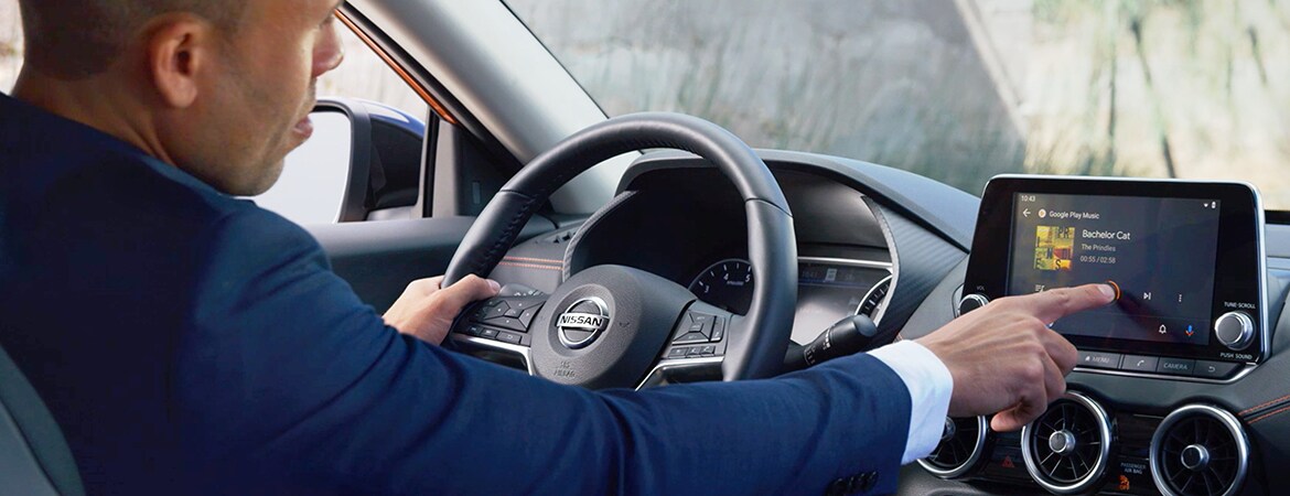 2023 Nissan Sentra with person using touch-screen for music, connectivity video.