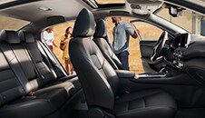 2023 Nissan Sentra seen from the passenger side, driver's side front and rear doors illustrating spacious interior.